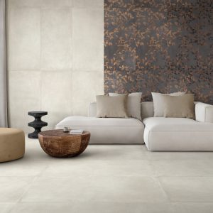 Stylish living room in beige tones with a sofa, a sconce, a wood